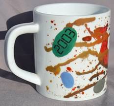 A mug with a design on it

Description automatically generated with low confidence